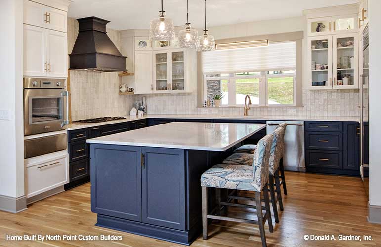 Beautiful accent colors in the lower cabinets and island in the kitchen. Dawson plan 1502