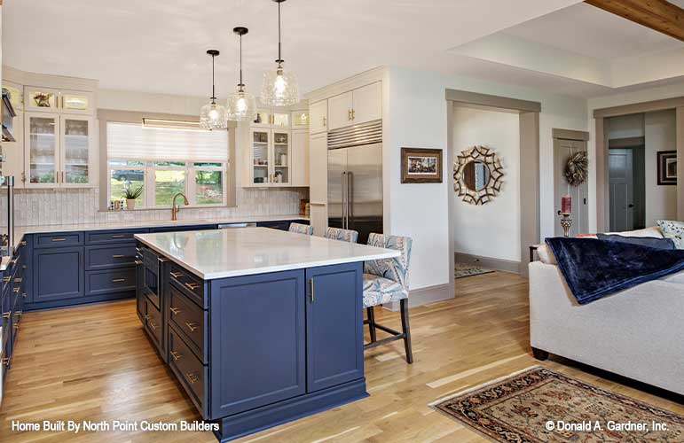 Full view of the kitchen showing the wide windows above the sink. 