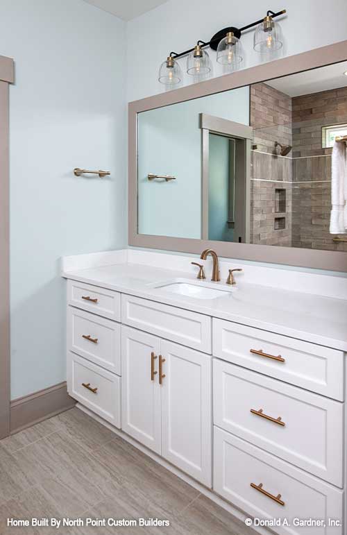 White vanity with gold hardware on the master vanity. Dawson plan 1502