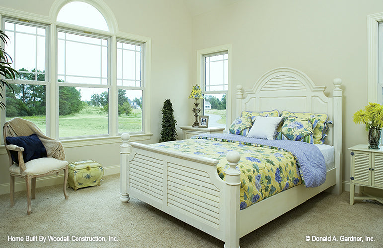 Large triple windows with half mood window in the master bedroom. The Dayton plan 1008.