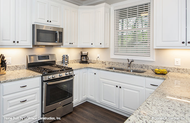 Kitchen counter and window picture of small house plan 1030 The Dewfield