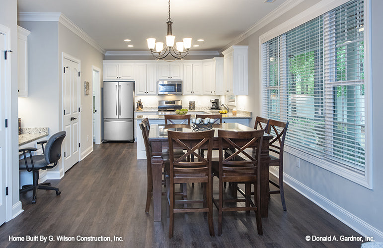 Picture of dining, nook and full kitchen of small house plan 1030 The Dewfield