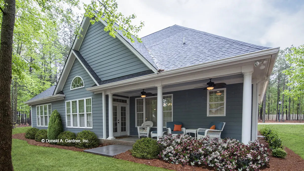 This is a photograph of the rear of ranch house plan 1030 The Dewfield as built by a customer