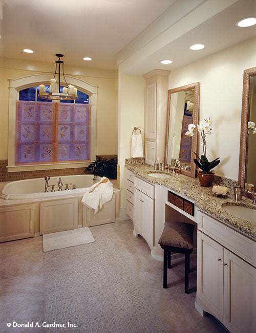 Double sink vanity beside sitting tub in the master bathroom. The Dogwood Ridge plan 5005.