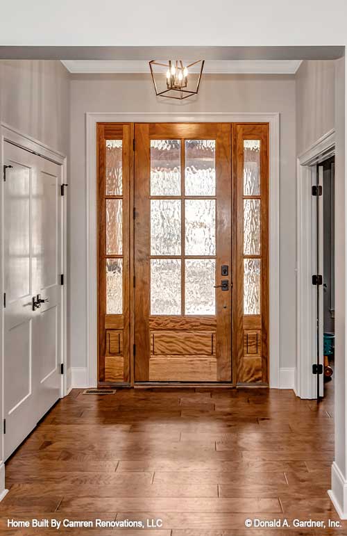 The foyer makes the first impression for visitors to craftsman house plan 1371 The Drake