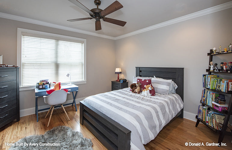 Crown molding along the ceiling and windows in the secondary bedroom. The Drayton Hall plan 1238.