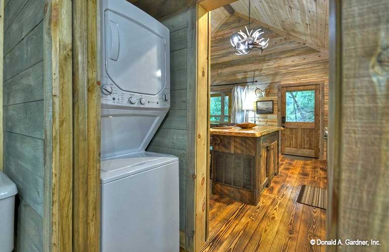 Picture from bathroom looking into kitchen of cabin house plan 1601 The Dwight as built by a customer