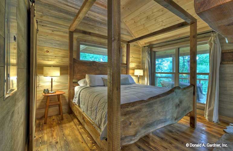 This picture is of the master bedroom of cabin house plan 1601 The Dwight as built by a customer