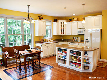 Flat ceiling and recessed lights in the kitchen. The Edelweiss plan 1013.