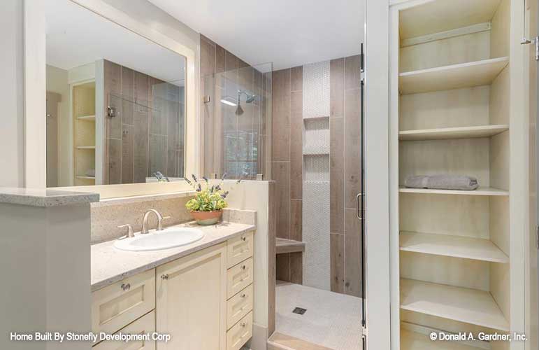 Single sink vanity next to the walk-in shower in the master bathroom. The Eleanor plan 1314.