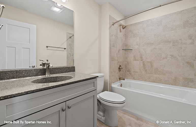 Single sink vanity and shower tub combination in the bathroom. The Ella plan 1344.