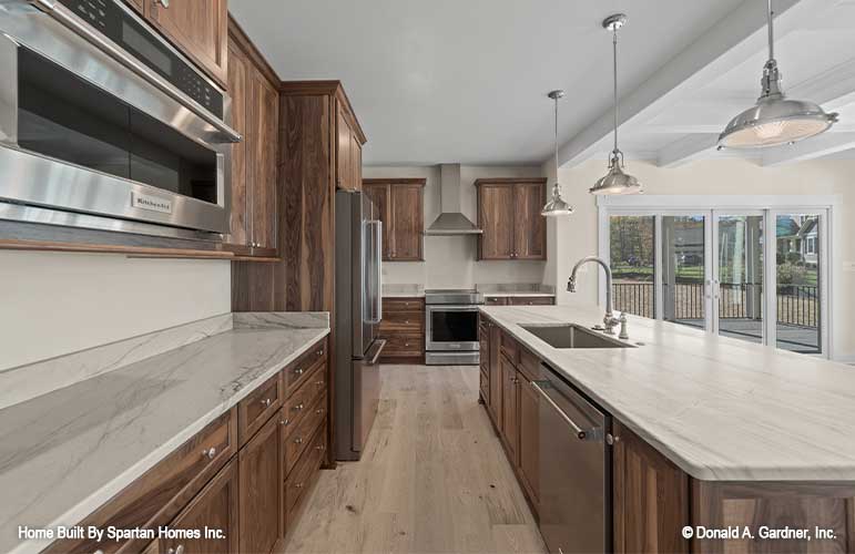 Stainless-steel appliances in the kitchen. The Ella plan 1344.