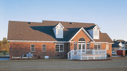 Rear view photograph with a deck and two dormers. The Emory plan 804.