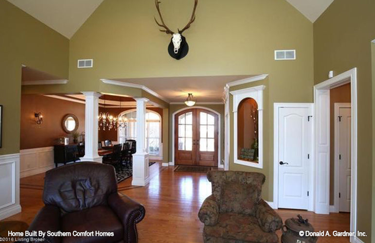 This is a photograph of the great room and dining area of one story house plan 1137 The Evangeline as built by a customer