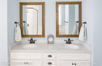 Double sink vanity in master bathroom of one story house plan 1047 The Fieldstone