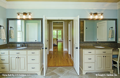 Two separate single sink vanities in the master bathroom. The Fincannon plan 1234.