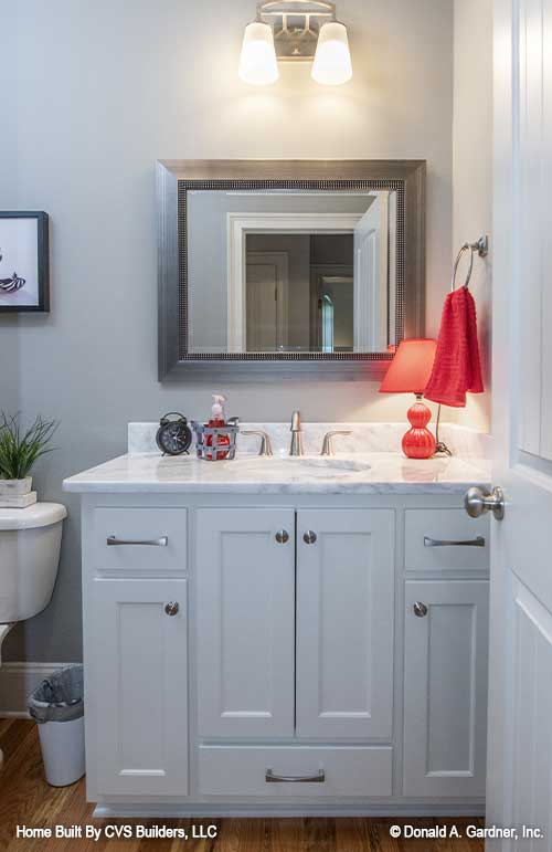 White sink vanity in the bathroom. The Fletcher plan 1430.