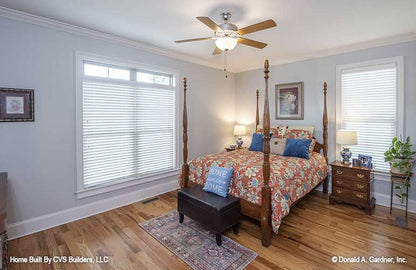 Crown molding along the ceiling and windows in the secondary bedroom. The Fletcher plan 1430.