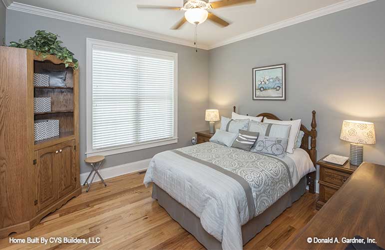 Grey walls and ceiling fan in the secondary bedroom. The Fletcher plan 1430.