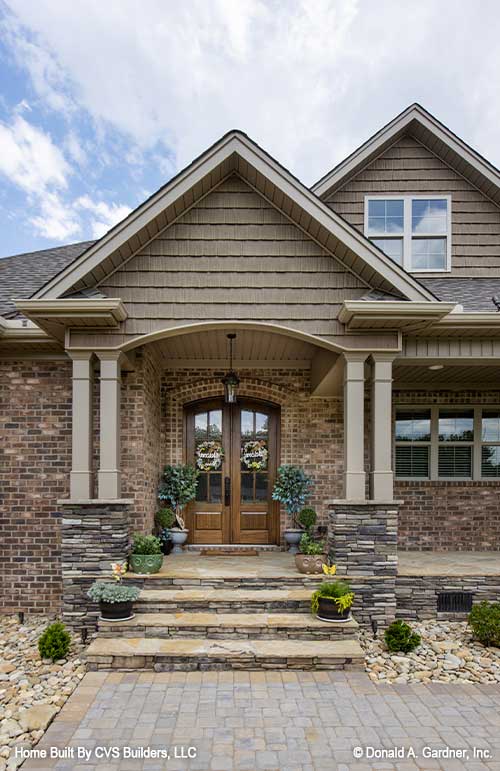 Stone steps leading to the front porch. The Fletcher plan 1430.