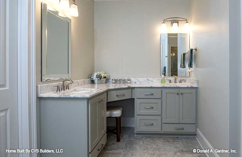 Double sink corner vanity in the master bathroom. The Fletcher plan 1430.