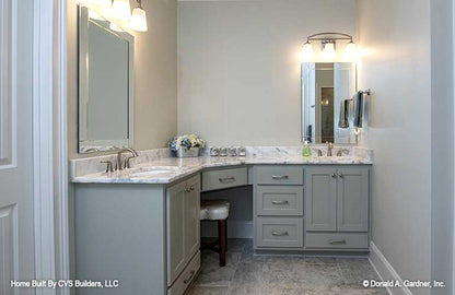 Double sink corner vanity in the master bathroom. The Fletcher plan 1430.