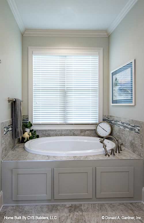 Window above the soaking tub in the master bathroom. The Fletcher plan 1430.