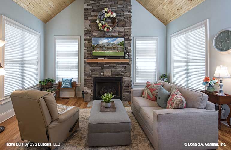 Floor to ceiling stone fireplace in the sitting room. The Fletcher plan 1430.