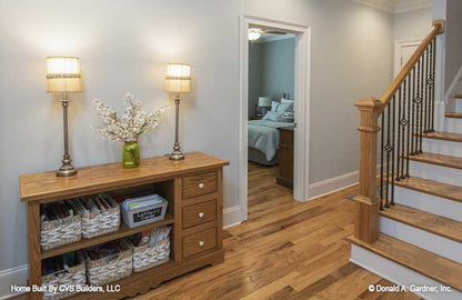 Wood flooring on the stairs. The Fletcher plan 1430.