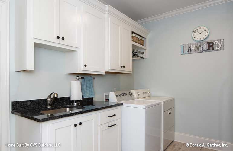 Sink and cabinets in the utility room. The Fletcher plan 1430.