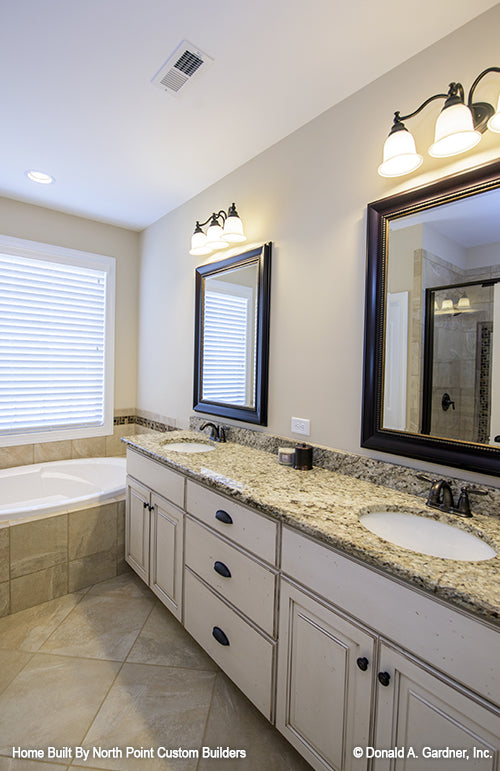 Double sink vanity in the master bathroom. The Foxglove plan 1297.