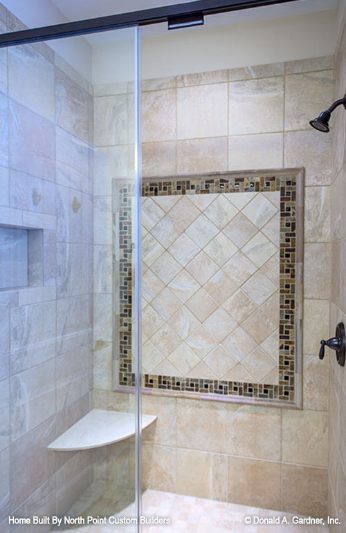 Walk-in shower with corner seat in the bathroom. The Foxglove plan 1297.