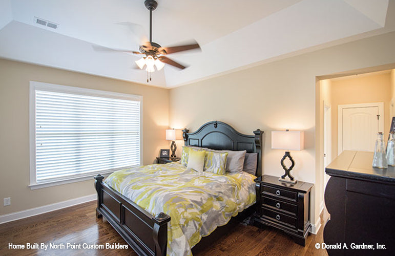 Tray ceiling and ceiling fan in the bedroom. The Foxglove plan 1297.