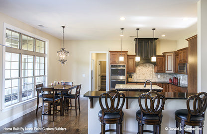 Bar seating in the kitchen. The Foxglove plan 1297.