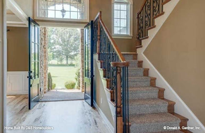 This is a photograph of the foyer of family house plan 1121 The Genevieve as built by a customer