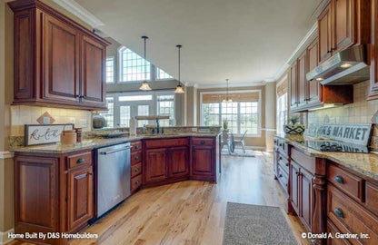 This is a photograph of the kitchen and breakfast room of family house plan 1121 The Genevieve as built by a customer