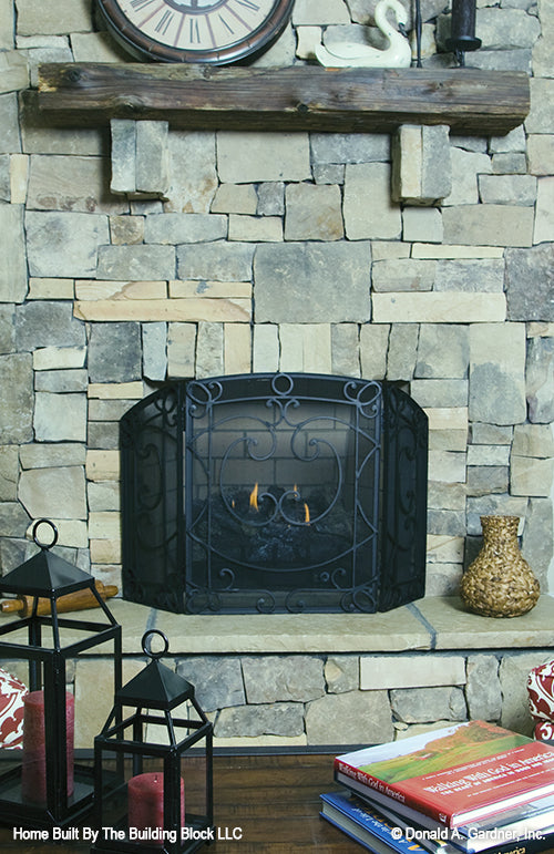 This is a fireplace picture of rustic house plan 1191 The Genova