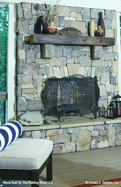 This is the fireplace on the screened porch picture of rustic house plan 1191 The Genova