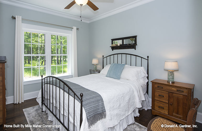 Double windows and ceiling fan in secondary bedroom. The Gentry plan 977.