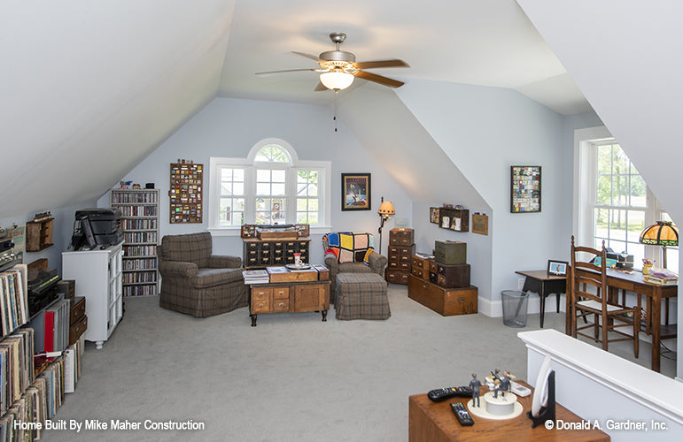 Ceiling fan and lots of natural light in the bonus room. The Gentry plan 977.