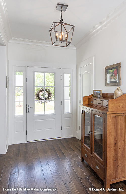 Crown molding and hanging light in the foyer. The Gentry plan 977.