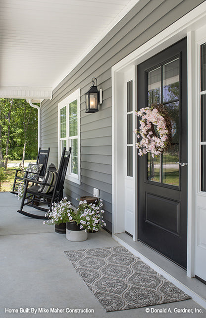 Covered front porch with rocking chairs. The Gentry plan 977.