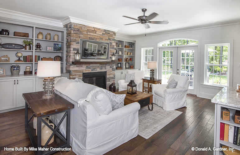 Floor to ceiling stone fireplace in the great room. The Gentry plan 977.