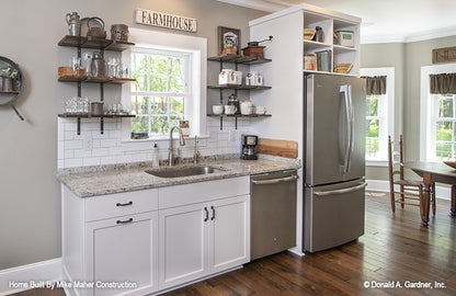 Cozy counter space with sink and window in the kitchen. The Gentry plan 977.