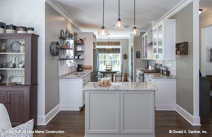 Island with pendant lights in the kitchen. The Gentry plan 977.