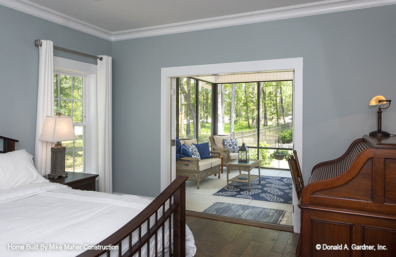 French patio doors open to the patio from the master bedroom. The Gentry plan 977.