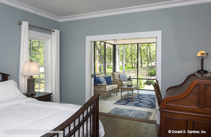 French patio doors open to the patio from the master bedroom. The Gentry plan 977.