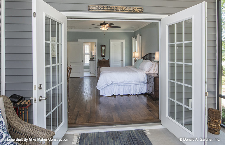 Patio view with doors open to the master bedroom. The Gentry plan 977.