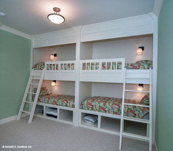 This is a photograph of the bedroom with bunks of mountain house plan 734 The Gilchrist as built by a customer