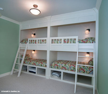 This is a photograph of the bedroom with bunks of mountain house plan 734 The Gilchrist as built by a customer